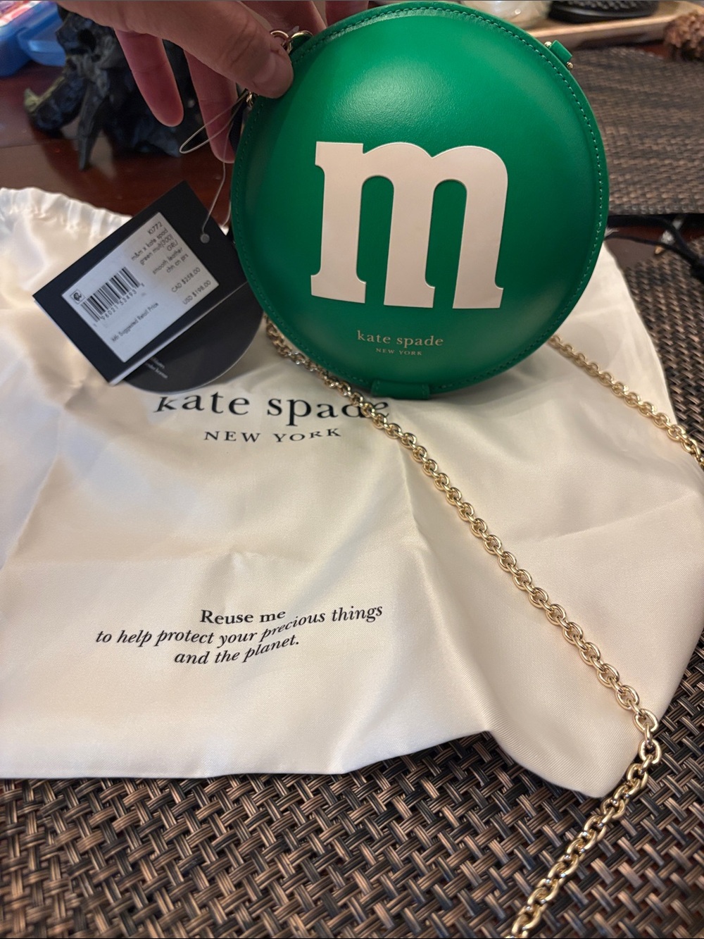 kate spade green round mini crossbody with white 'M'